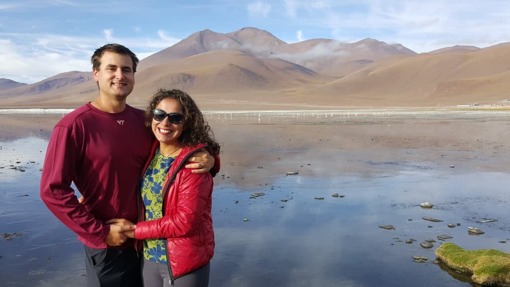 Chris Heckmann and Nimarta Bawa at Volcanic Lake in Bolivia