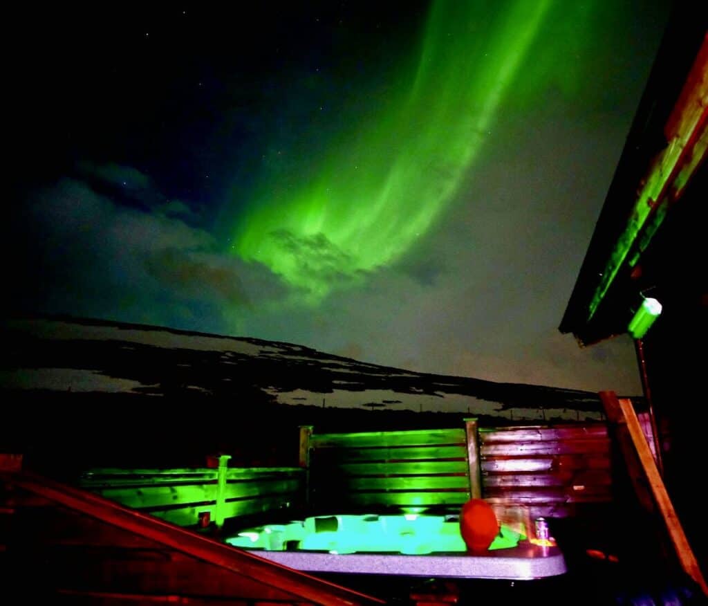 Iceland hot tub under the northern lights