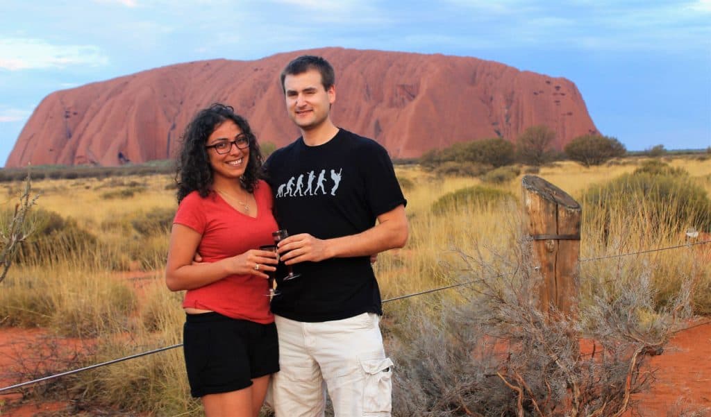 Chris Heckmann and Nimarta Bawa in front of Uluru in central Australia