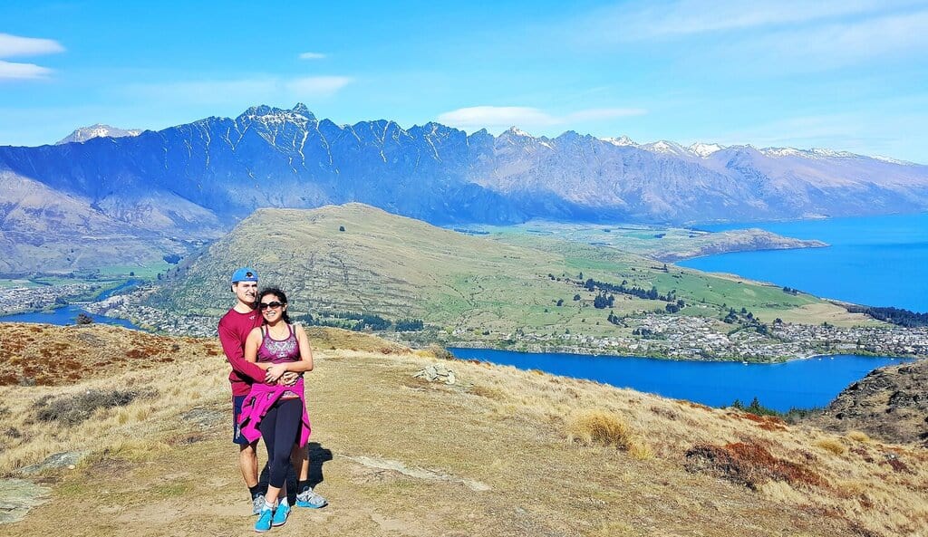 Chris Heckmann and Nimarta Bawa in Queenstown, New Zealand in front of the Remarkables