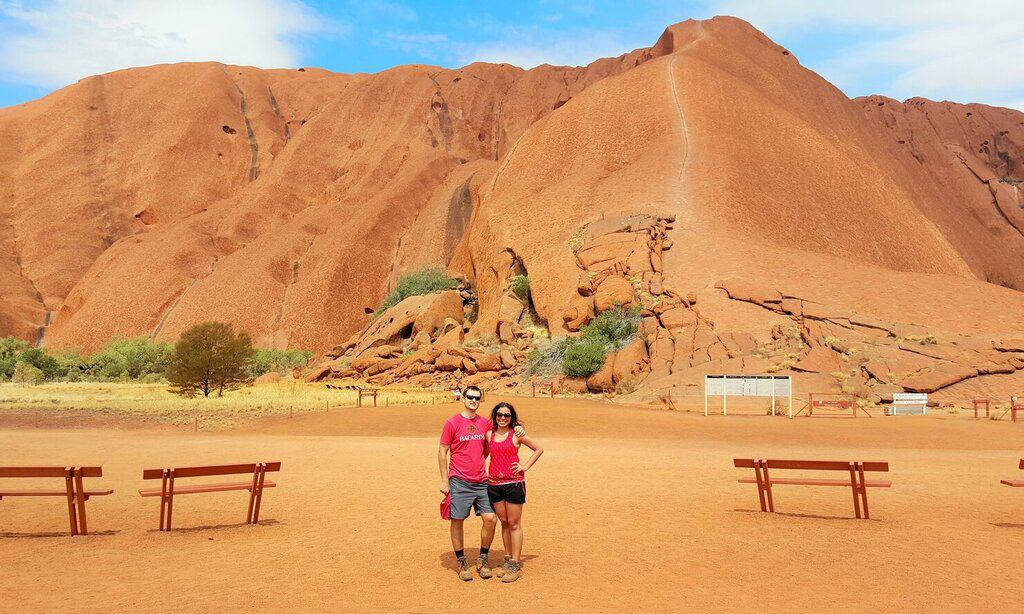 Chris Heckmann and Nimarta Bawa in front of Uluru 