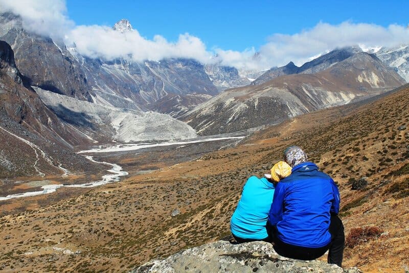 A couple appreciating the view in the Himalayas