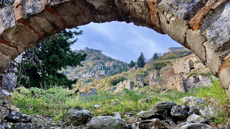 Mystras view through a brick arch in Greece
