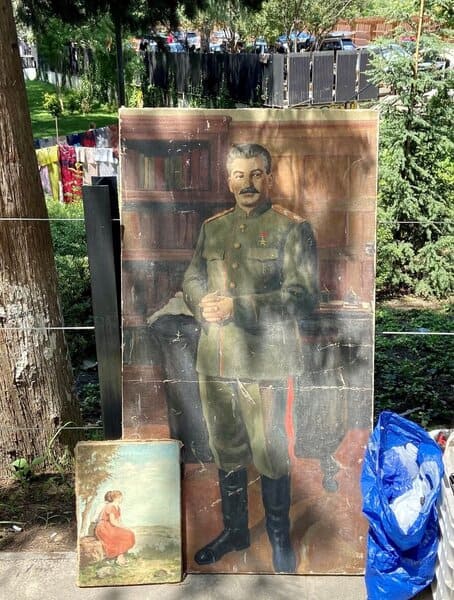 A photo of a painting of Joseph Stalin in a Tbilisi street market