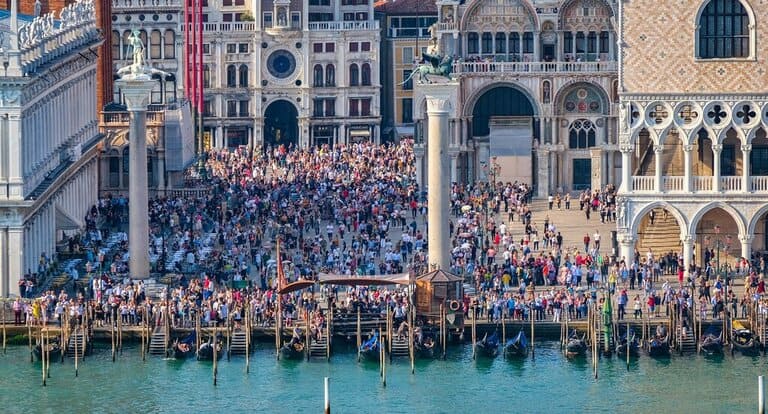 A large crowd in Venice in front of the Doge's Palace