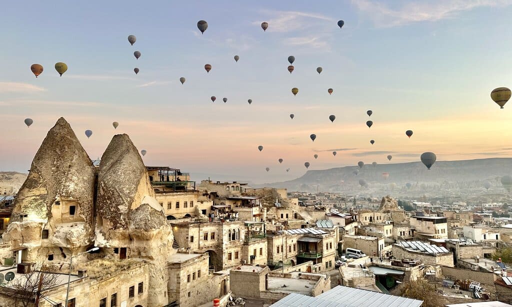 hot air balloons flying over Goreme in Cappadocia in winter