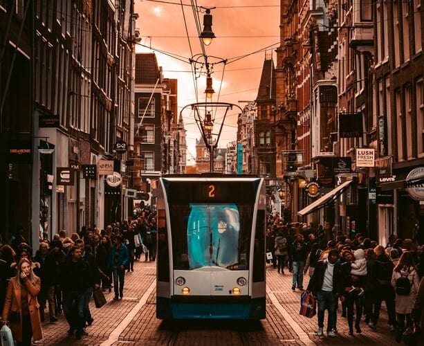 A tram going through central Amsterdam