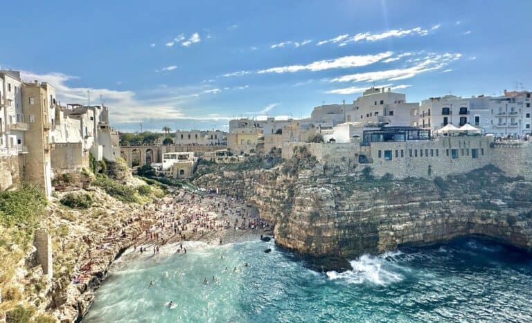 Polignano a Mare view of the beach ona crowded day