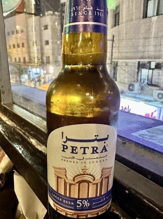 A Petra beer bottle at a bar in Amman