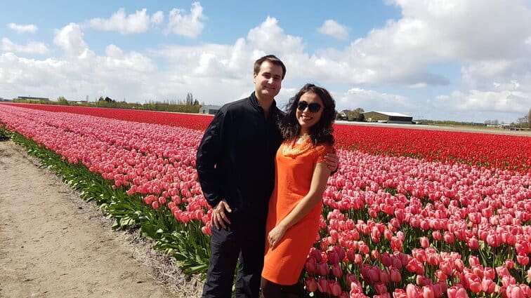 Chris Heckmann and Nimarta Bawa in the Lisse tulip fields - best time of year to visit the Netherlands