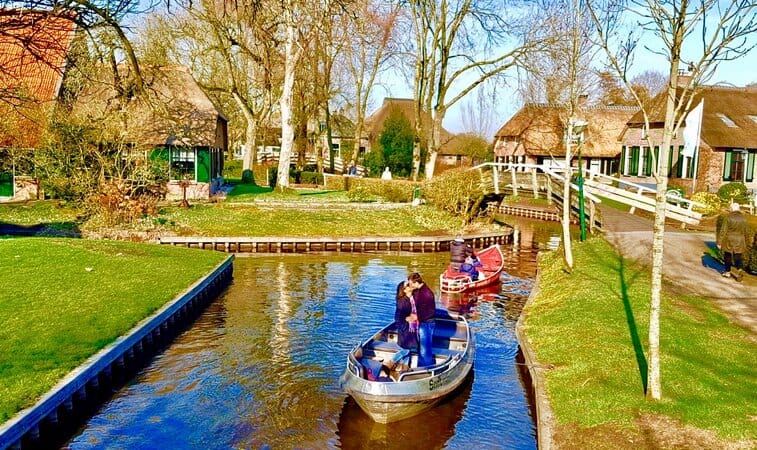 Winter in Giethoorn - a couple kissing on the canal in a boat