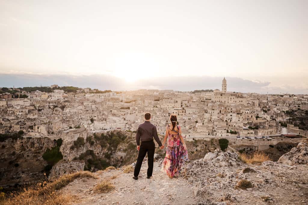 Chris Heckmann and Nimarta Bawa in front of Matera, Italy