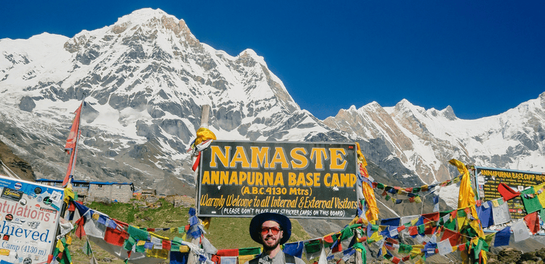 A hiker reaching base camp of Annapurna mountain in Nepal
