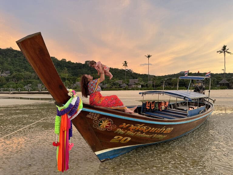 Nimarta Bawa on a long boat at sunset in Thailand