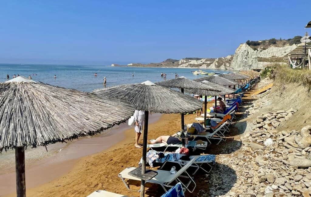 Xi Beach in Kefalonia with beach umbrellas