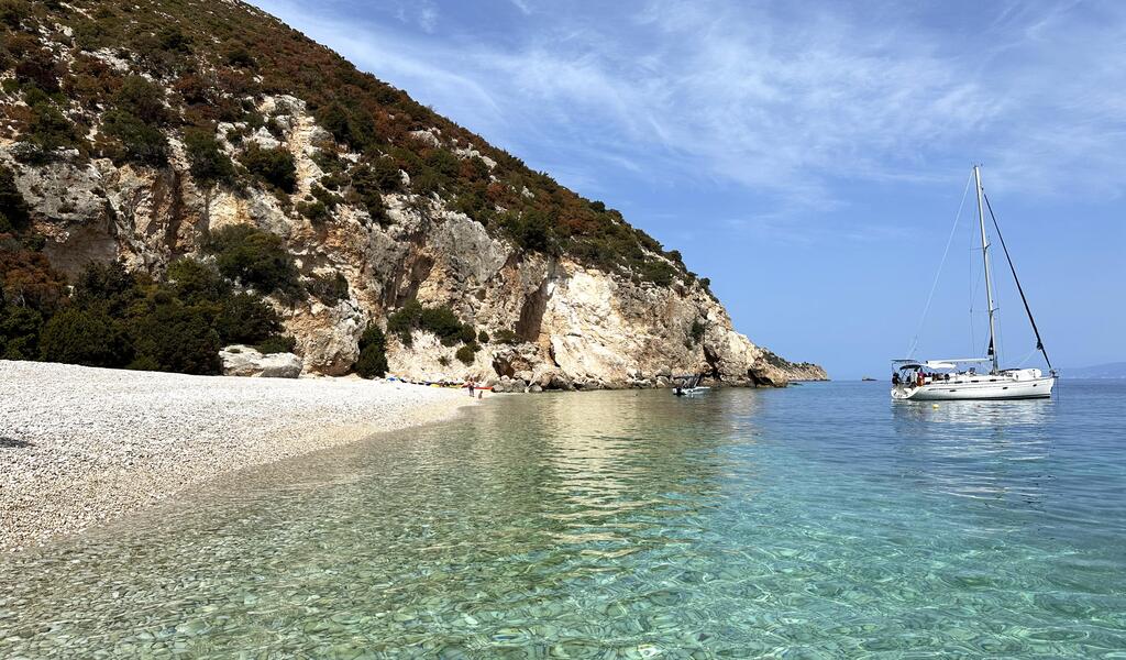 Kamari Beach in Kefalonia with clear, calm water