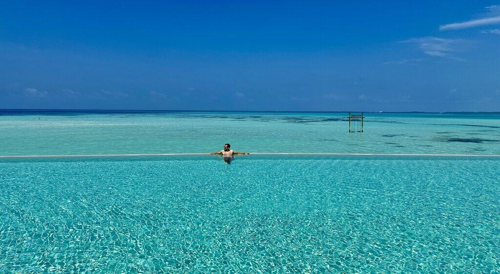 a swimmer in a pool at Jawakara Maldives